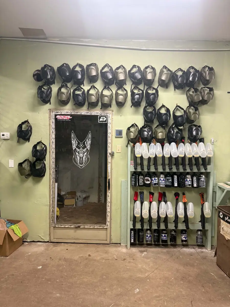 Rental wall lined with masks, rental markers, and air tanks